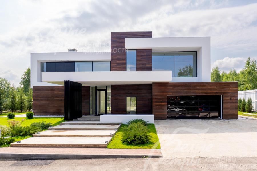 Новый дом, построенный в духе минимализма и кубизма по авторской методике интегральной архитектуры Ильи Елисеева