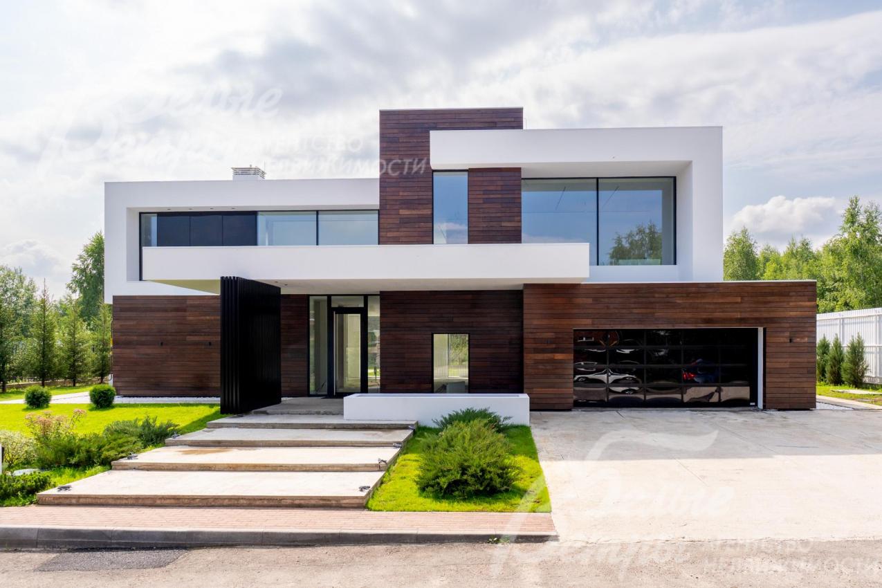 Новый дом, построенный в духе минимализма и кубизма по авторской методике интегральной архитектуры Ильи Елисеева